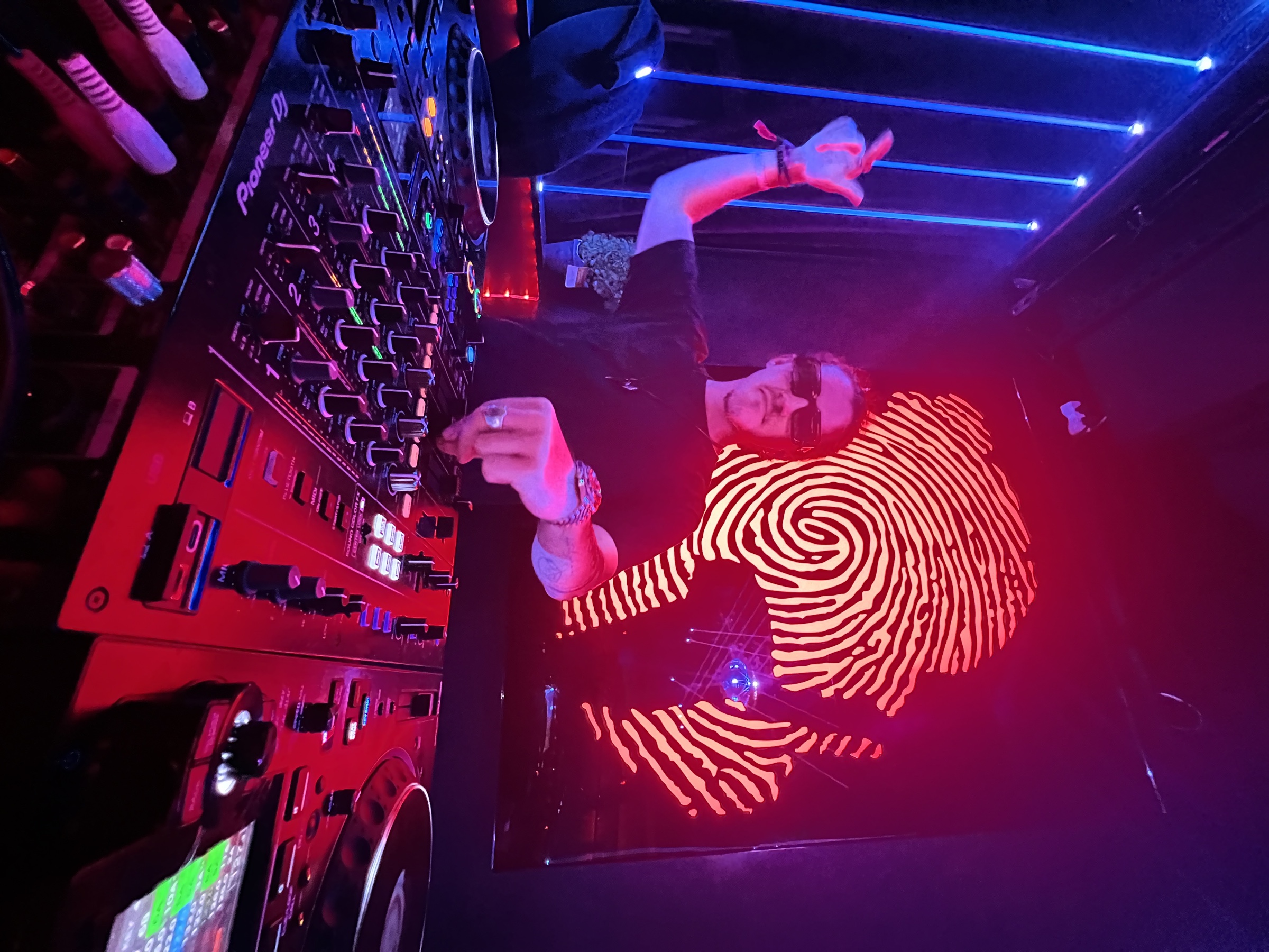 Smooth Talk performing at a nightclub DJ booth